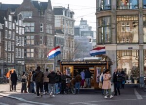 Herring stall on an Amsterdam street, with customers queueing