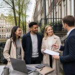 People discussing rental agreements outside residential buildings along an Amsterdam canal with bicycles and traditional houses in the background.