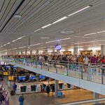 Schiphol Airport, queues at security control, June 2022. Photo by Ymblanter, CC BY-SA 4.0, via Wikimedia Commons.