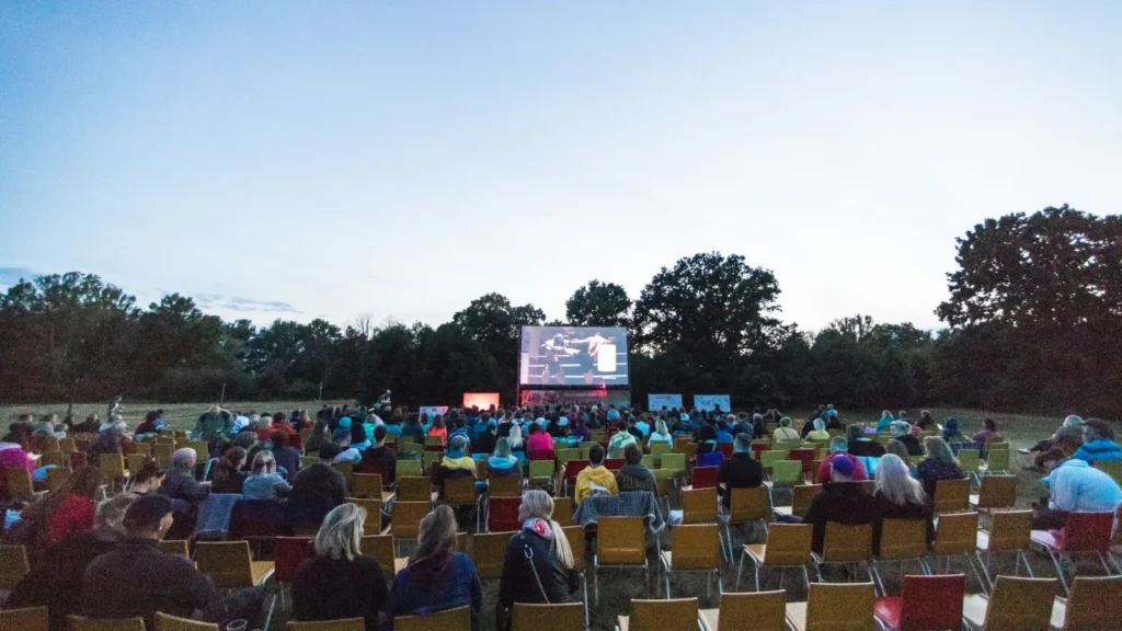 Open-air film screening at dusk