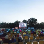 Open-air film screening at dusk