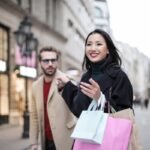 Shoppers with bags on a city shopping street