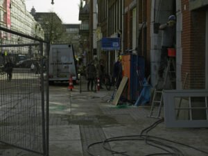 Street_scene_of_Amsterdam-West_with_buidling_fences_near_Kin