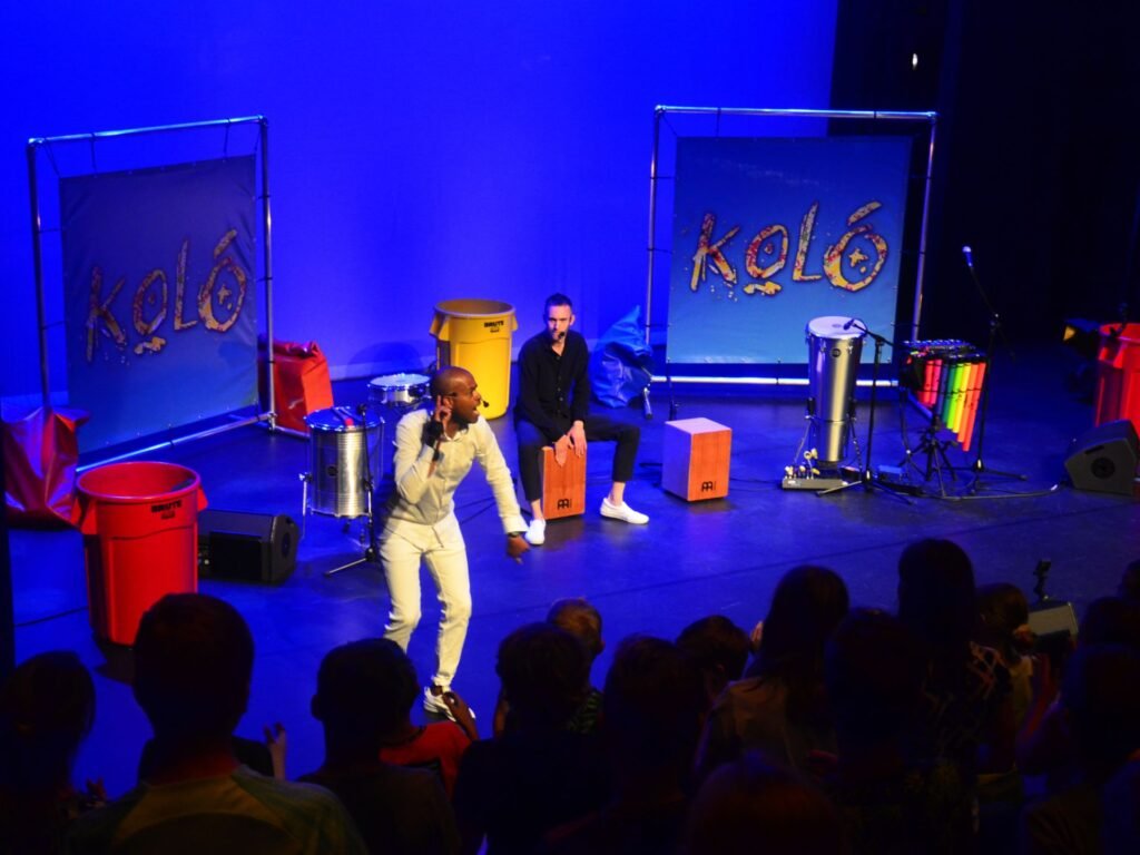 Outdoor rhythm and boomwhacker theater in KOLÓ