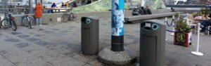 New grey bins with a bottle and can opening on the IJ side of Amsterdam Centraal