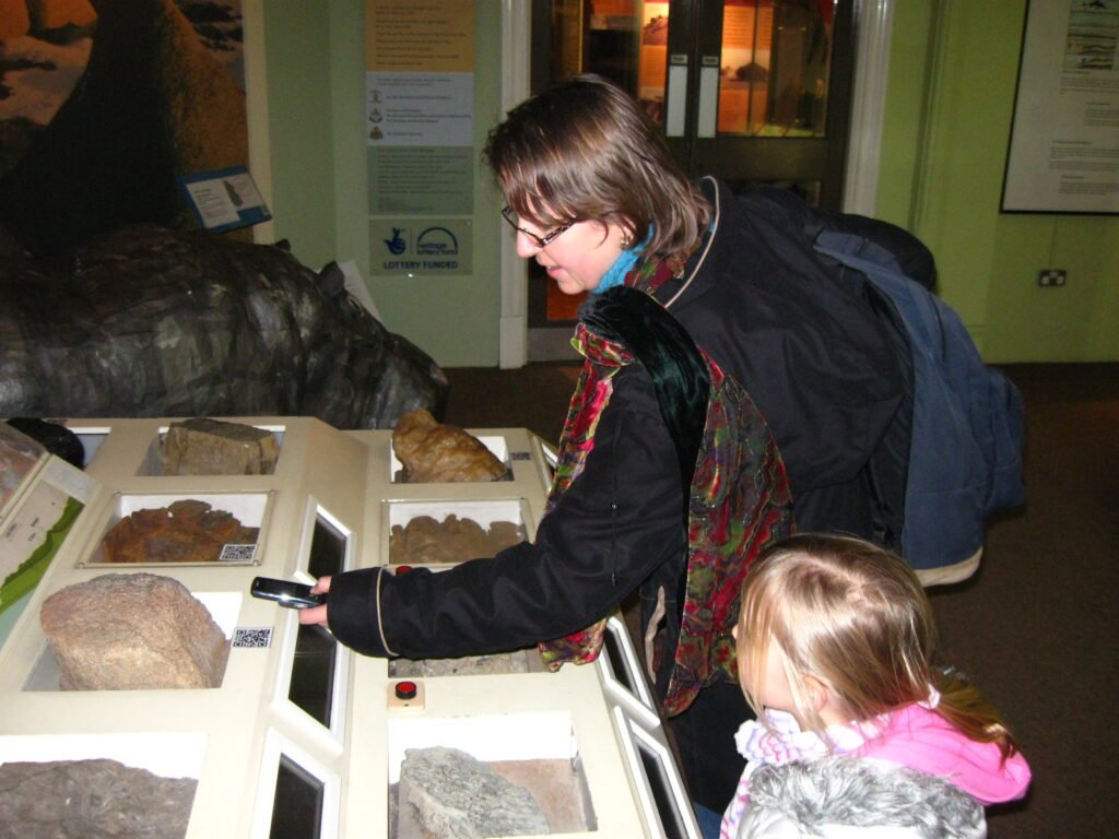 Derby_Museum_visitor_uses_QR_Code-1