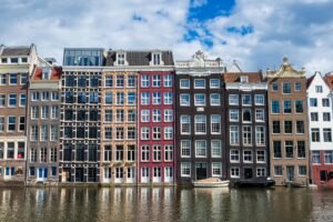 Canal houses in Amsterdam reflected in the water