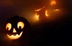 Carved jack-o'-lanterns lit at night