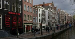 Oudezijds Achterburgwal canal in the Red Light District by day